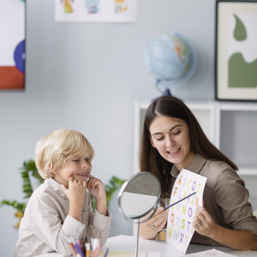 woman-doing-speech-therapy-with-little-boy-her-clinic (2)